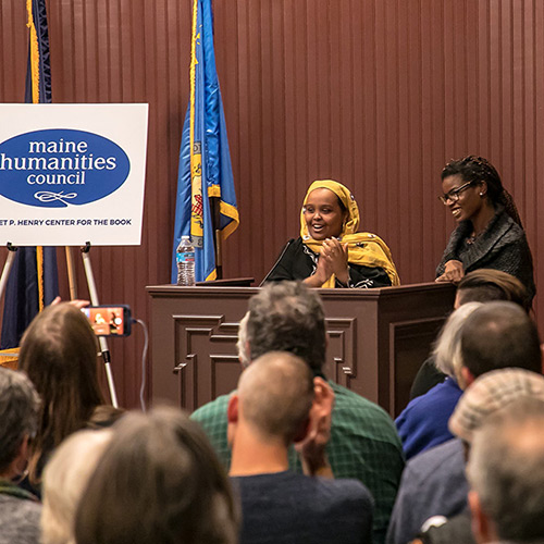 Students from the Lewiston 21st Century Program read their own poems and introduce Tracy K. Smith's 'American Conversations' event at the Lewiston Public Library in Lewiston, ME. November 1, 2018. Credit: Erik Peterson.