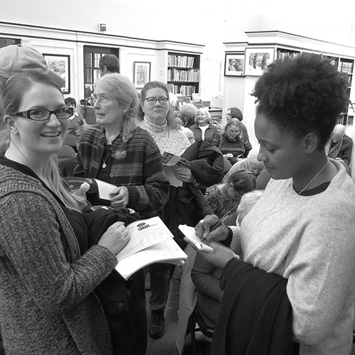 Tracy K. Smith signs copies of 'American Journal' for event attendees at the Norway Memorial Library in Norway, ME. November 1, 2018. Credit: Peter Herley.