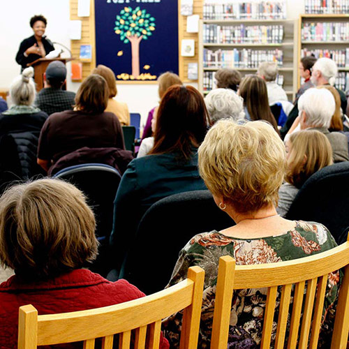 A crowd gathers to hear Tracy K. Smith read from and discuss 'American Journal' at the Sturgis Public Library in Sturgis, SD. October 6, 2018. Credit: Ryan Woodard.