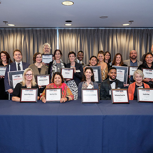 Representatives from 18 organizations are recognized for making outstanding contributions to increasing literacy in the United States or abroad.