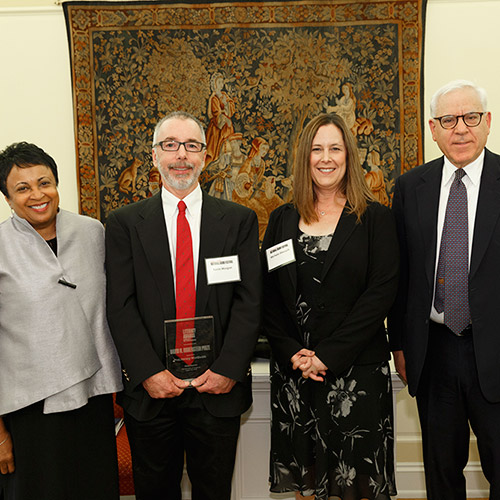 Kevin Morgan and Michele Diecuch, representing ProLiteracy Worldwide, accept the David M. Rubenstein Prize, presented by Librarian of Congress Carla Hayden and David M. Rubenstein.