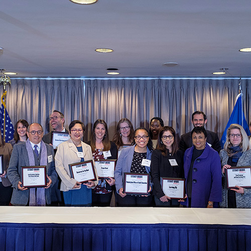 Representatives from 15 organizations are recognized for implementing best practices in the categories of youth literacy, adult literacy, multigenerational literacy, programs for people with learning differences, and innovative uses of technology.