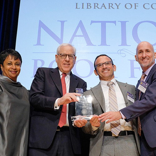 Joel Zarrow and Frank Grossman, representing the Children's Literacy Initiative, accept the David M. Rubenstein Prize, presented by Librarian of Congress Carla Hayden and David M. Rubenstein.