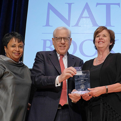 Sharon Darling, representing the National Center for Families Learning, accepts the American Prize, presented by Librarian of Congress Carla Hayden and David M. Rubenstein.