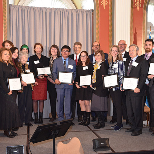 Representatives from the 14 organizations recognized for implementing best practices in literacy promotion receive certificates.