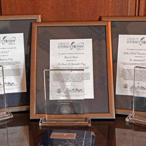 The 2014 Library of Congress Literacy Awards trophies and certificates for the Rubenstein Prize, American Prize and International Prize.